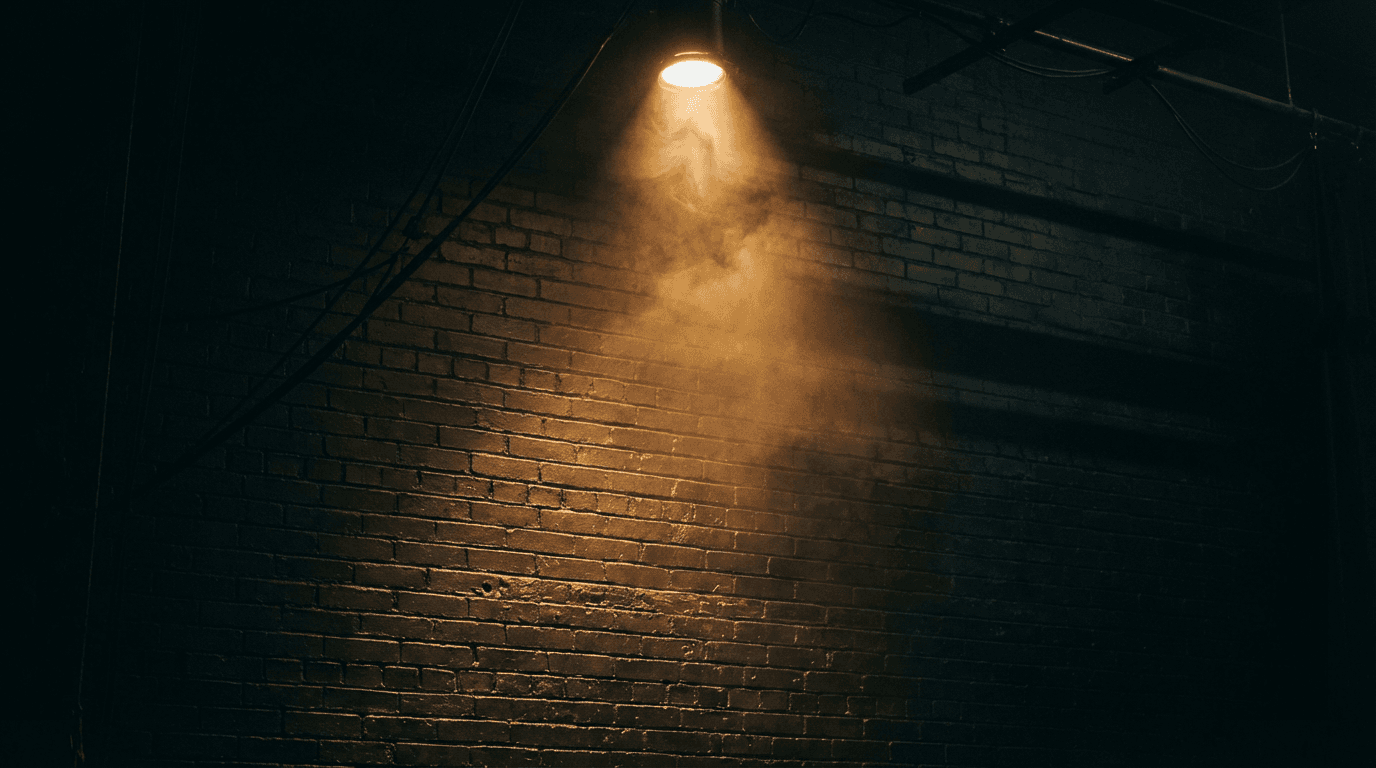 Speaker and uplighting setup in a dark event space